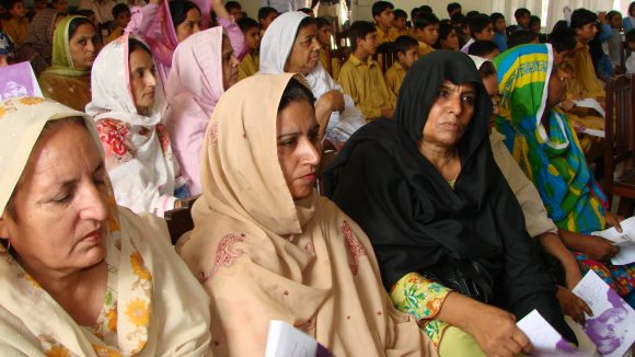 Representatives, teachers, and children attend a seminar on World Sight Day in Pakistan.