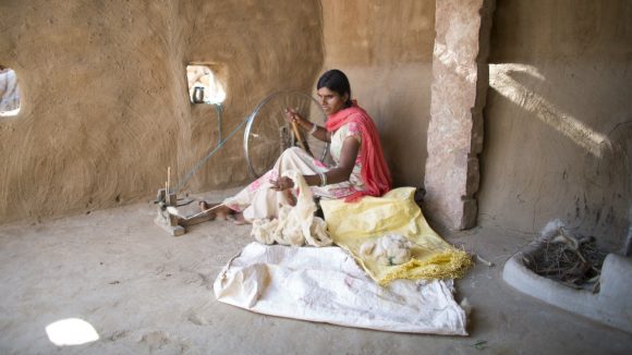 Bhanvari, who is blind, weaves in her home in the Bikaner district of India.