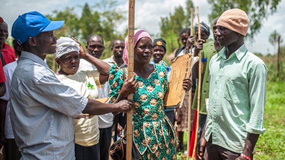 Students practice using measuring sticks to calculate drug dosages in Masindi, Uganda.