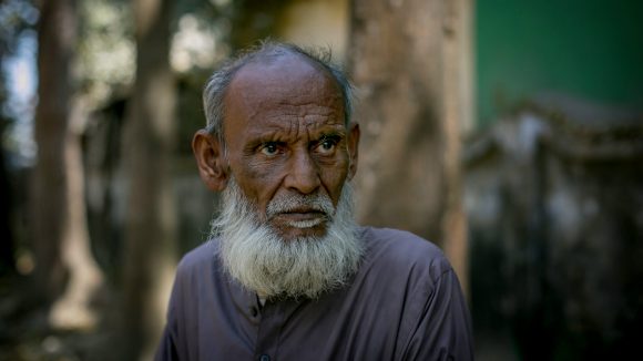 A man stands alone in Bangladesh.