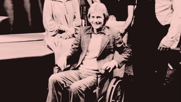 Actor Roger Tonge on set at Crossroads, sitting in a wheelchair.