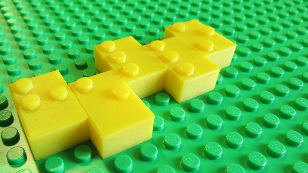 A close-up of the yellow braille bricks, which feature braille characters on the top.