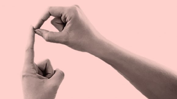 A close-up of hands doing sign language.