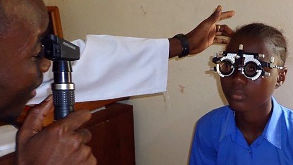 A girl having her eye sight tested.