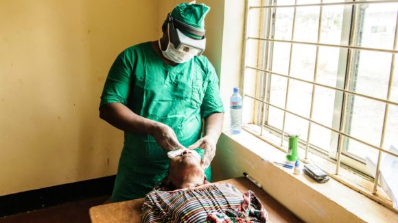Dr Lukanga operating on Aluna at the surgical camp