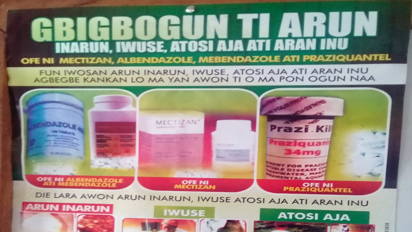A poster written in Yoruba showing images of medication and writing.