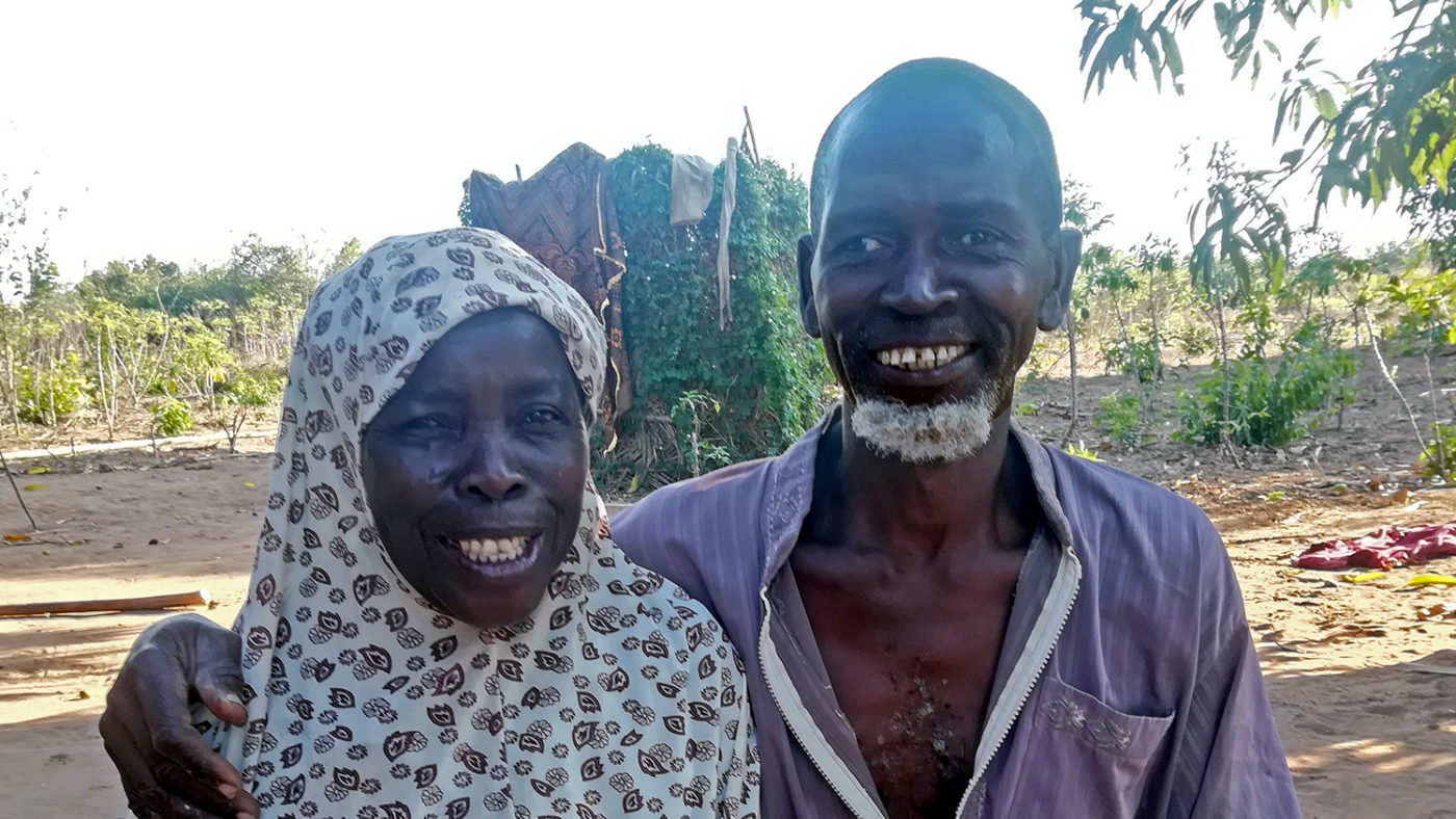A man and a woman smiling.