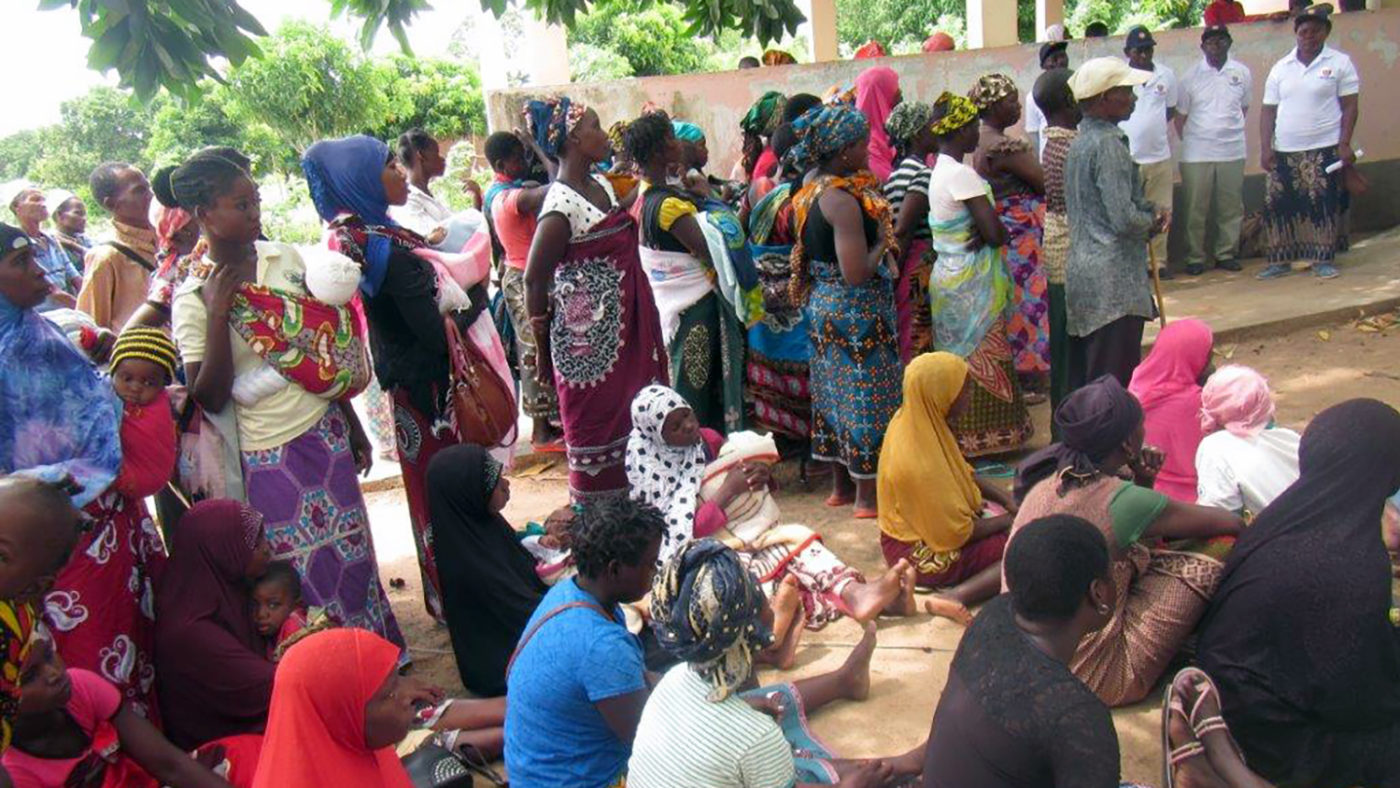 A group of women gather to have their eyes checked.