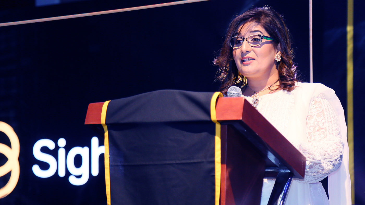 Haya Mashhood on stage at the event.