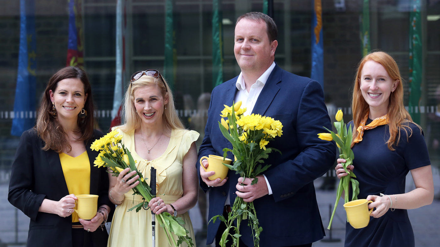Staff from Sightsavers and Post Insurance smile with Bright for Sight ambassador Sinead Kane.