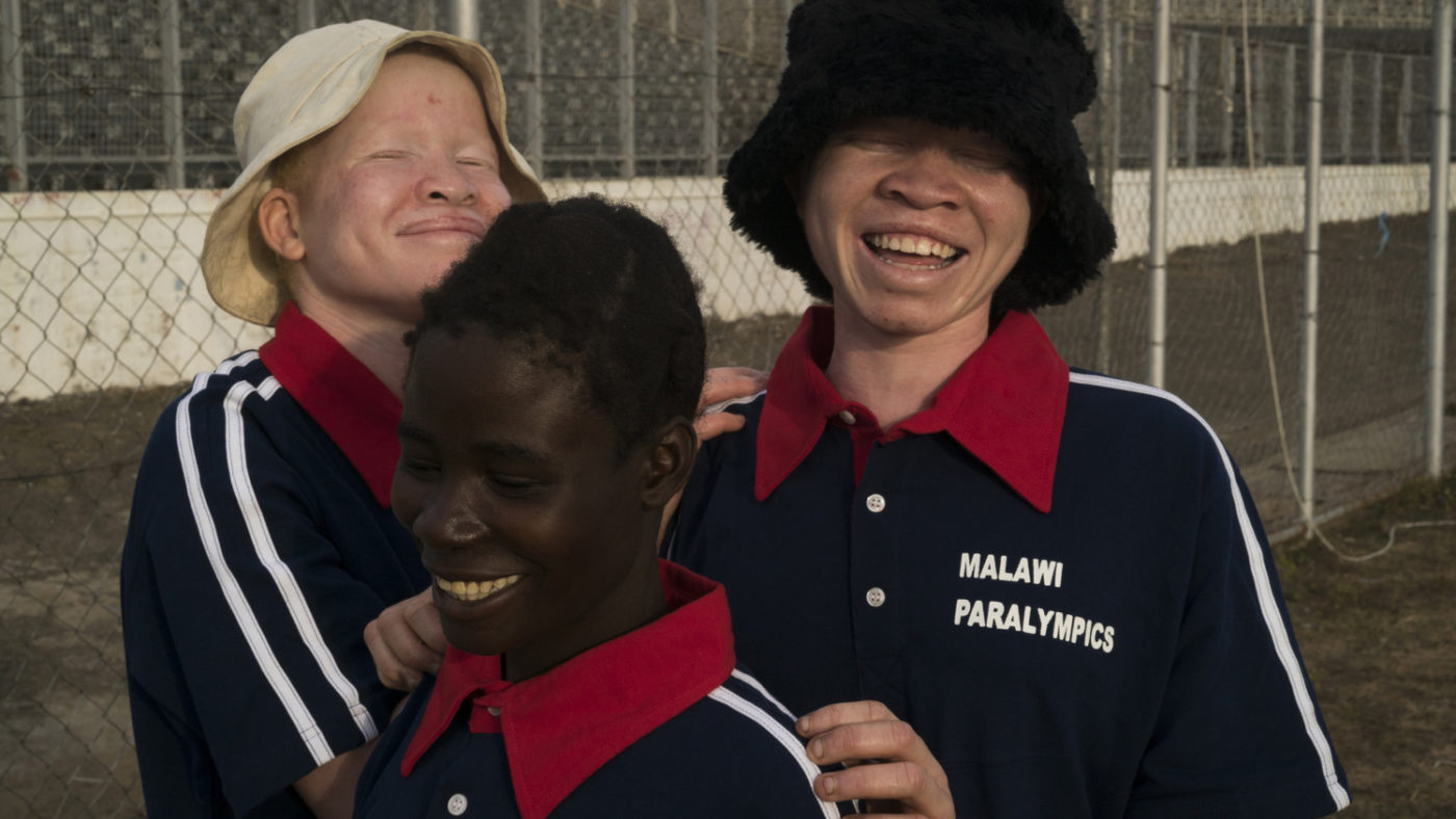 Three women laughing together