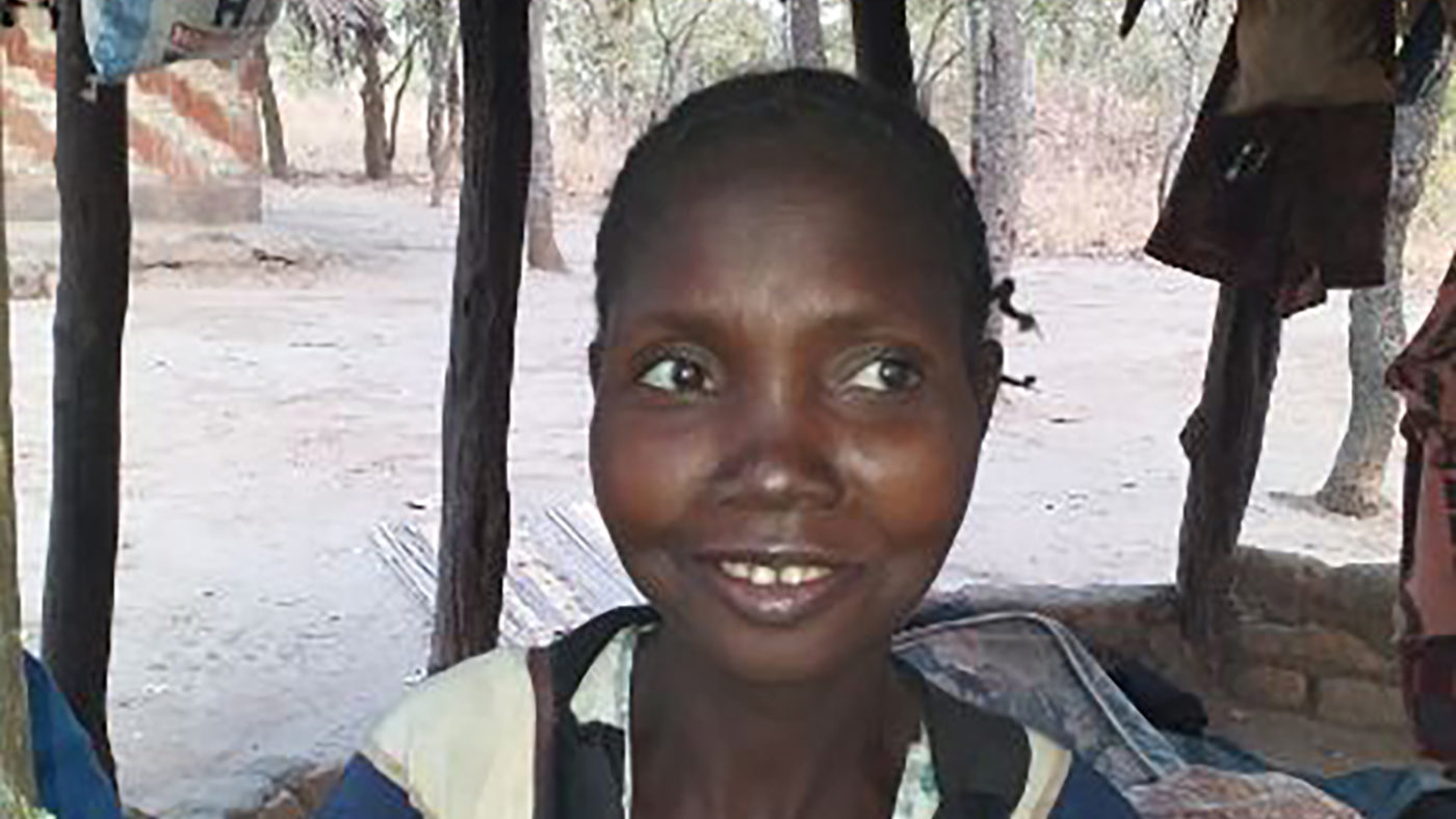 A woman smiles.