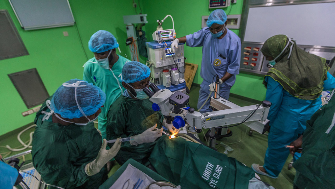 A group of medical staff surround Khadijah during her operation.