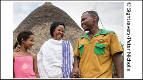 Example of a photo credit, with text running vertically down the side of the image that reads: '© Sightsavers/Peter Nicholls'.