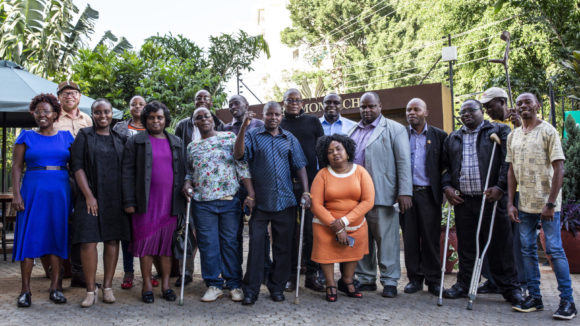 A group of Disabled Person Organisation (DPO) representatives meet in Nairobi, Kenya for advocacy training and planning as part of the Inclusive Futures initiative.