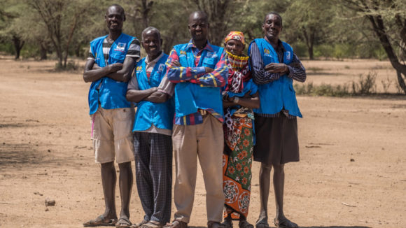 Community health volunteers stand outside in Nachuru, Turkana, Kenya.