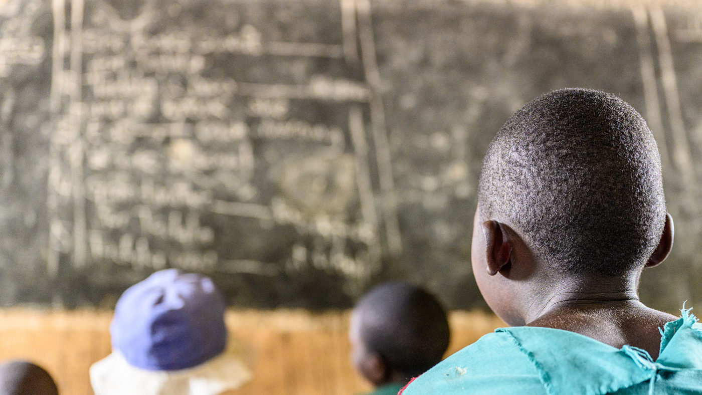 Mary trying to read the chalkboard at school.