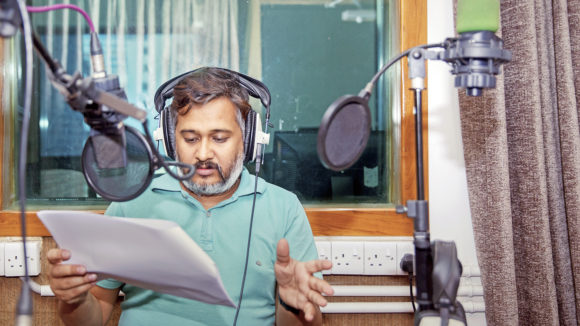 A man talking into a microphone.
