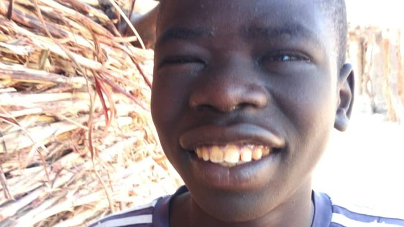 Boy smiling after a successful trichiasis surgery.