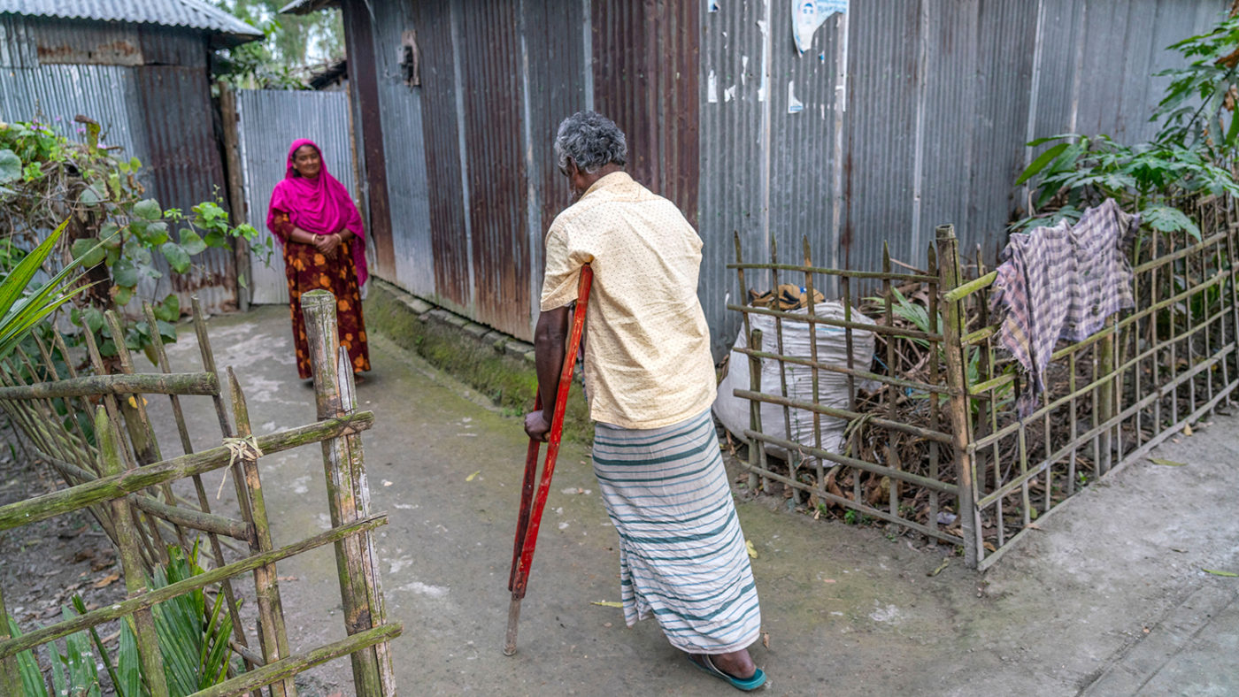 A man using crutches to walk.