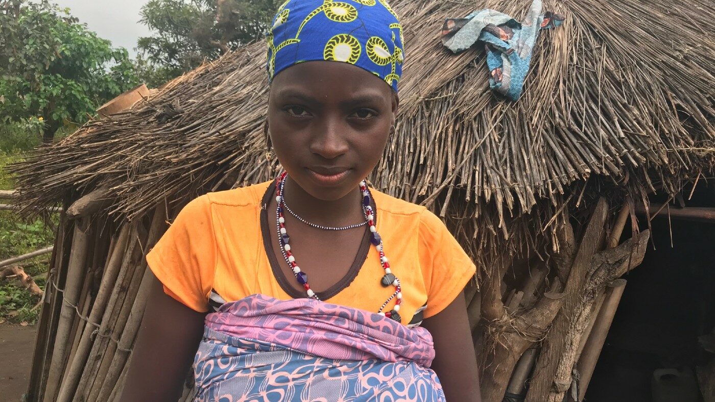 A woman stands for a portrait.