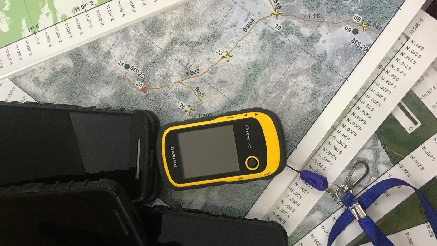 Image of a mobile device and a map.