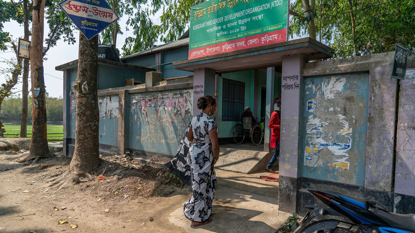 Women walking into a screening camp.