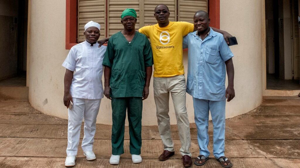 Surgical team standing together outside the clinic