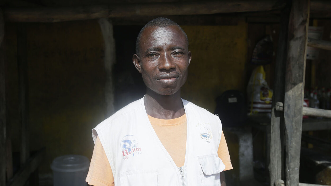 A man stands for a portrait.