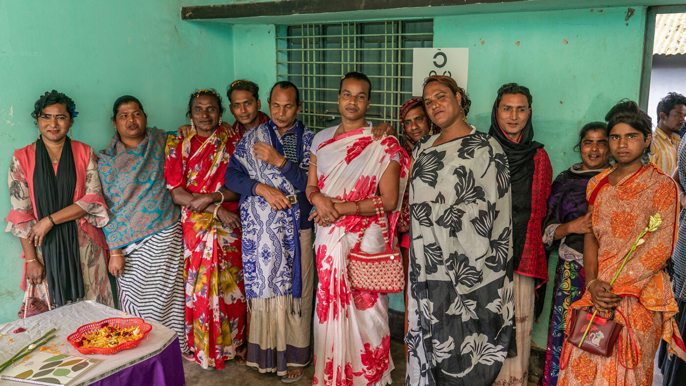 A group of people standing in a room.