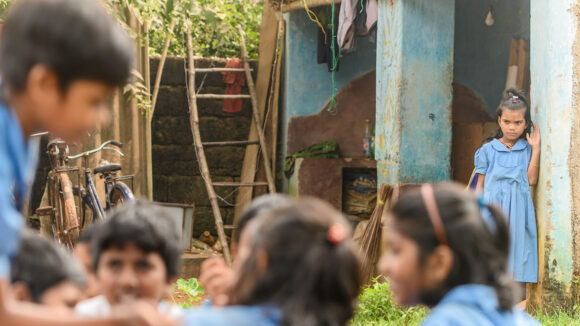 Archana is watching as she struggles to actively join in with her friends playing.