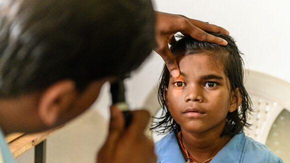 Archana is having her eyes screened for cataracts.