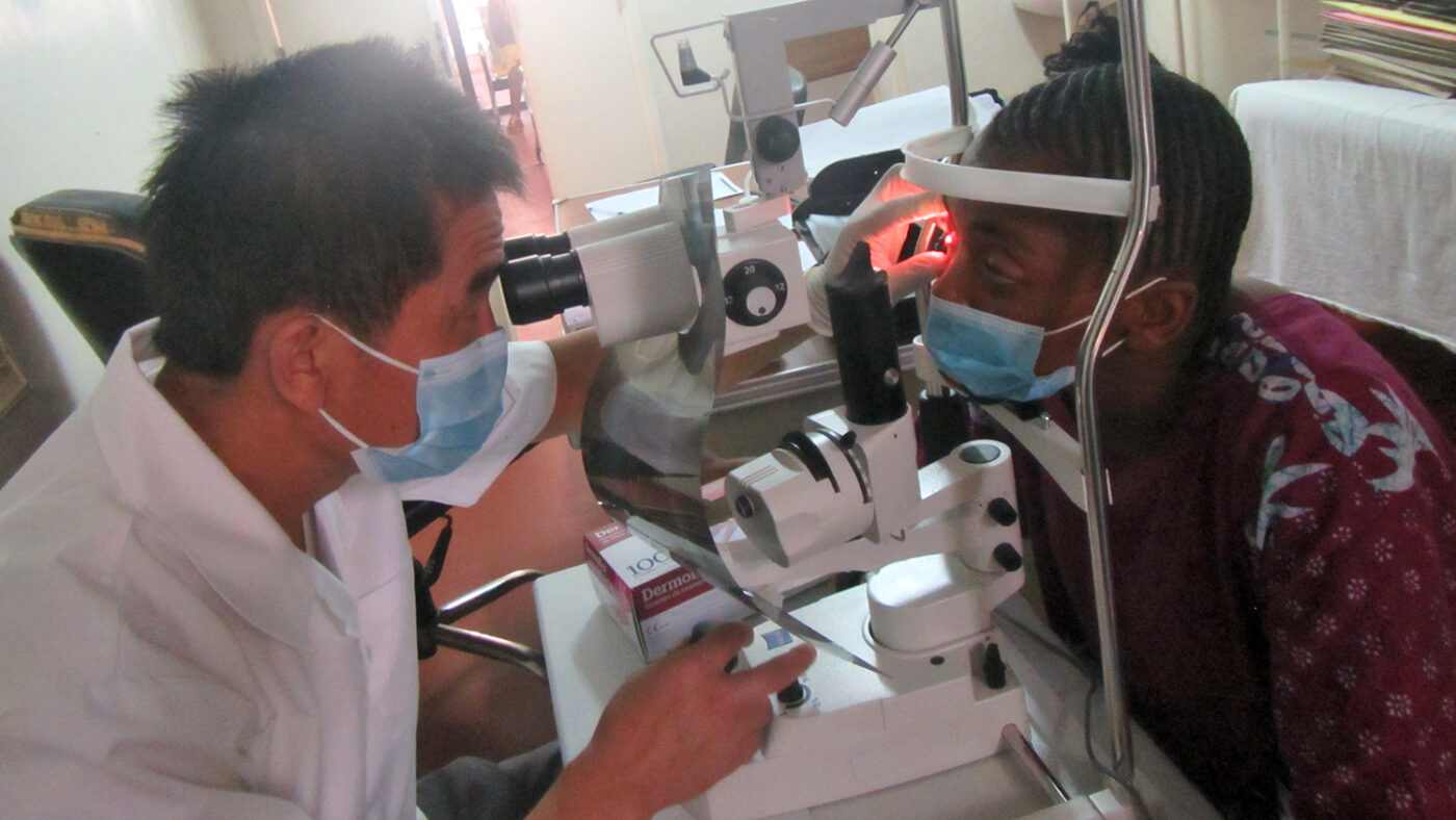 Viki Wilonge Hussene has her eyes examined by a health worker.