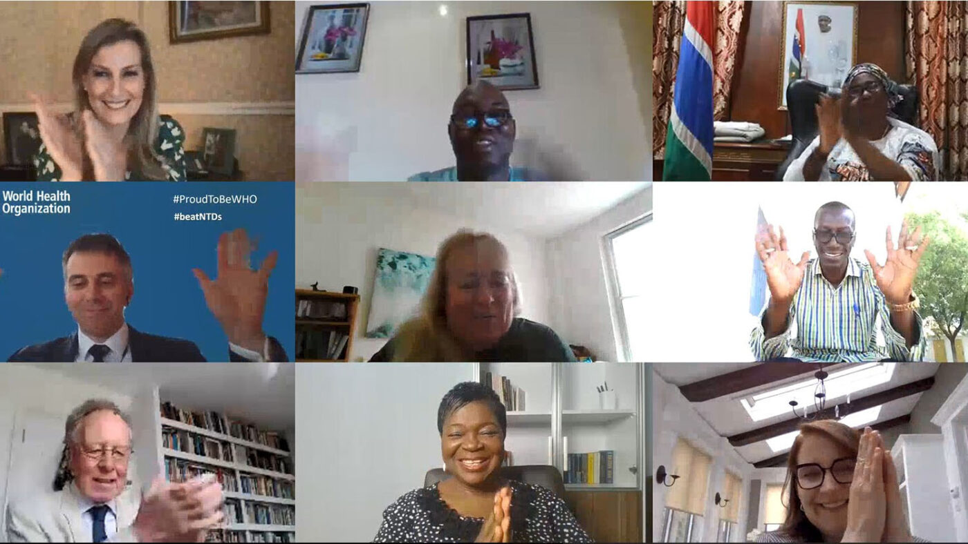 The Countess of Wessex on a video call with key representatives involved in the elimination of trachoma in The Gambia. All participants are clapping their hands in celebration.