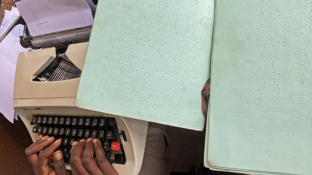 A close-up of pages from a braille school book.
