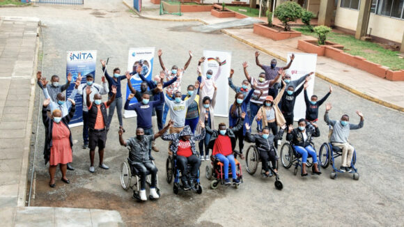 Students of the Bridge Academy in Kenya stand outside.