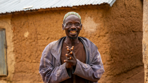 A man smiles at the camera.