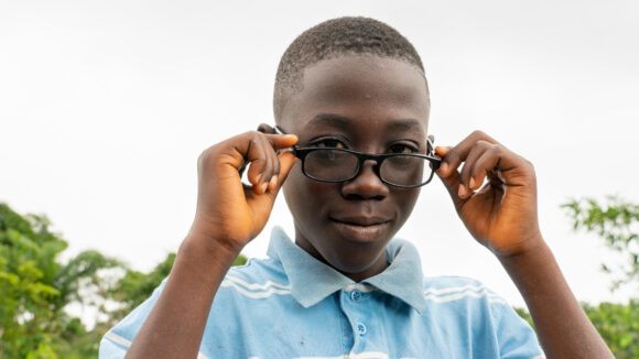 Arthur from Liberia wearing his new glasses.