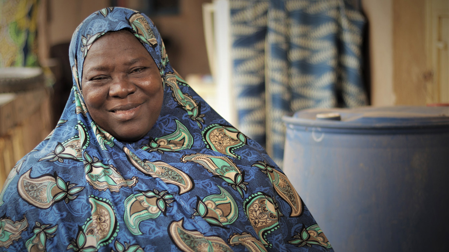 Salifat smiles at the camera