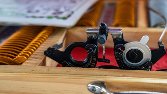 Close-up of eye test equipment, including specialist spectacles and lenses.