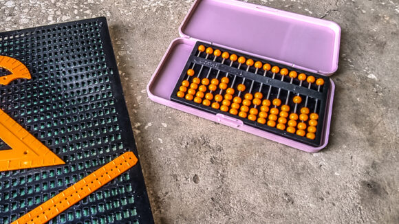 A braille board and geometry set supplied by sightsavers.