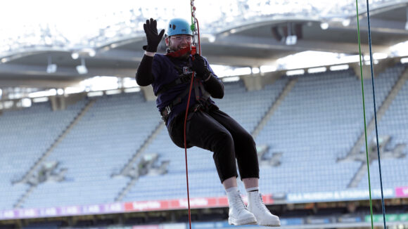 Cian from Ocuco abseiling from the roof of Croke Park in Dublin.