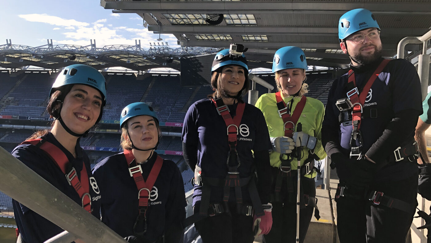 A group of five men and women wear harnesses for the World Sight Day abseil at Croke Park in Dublin.