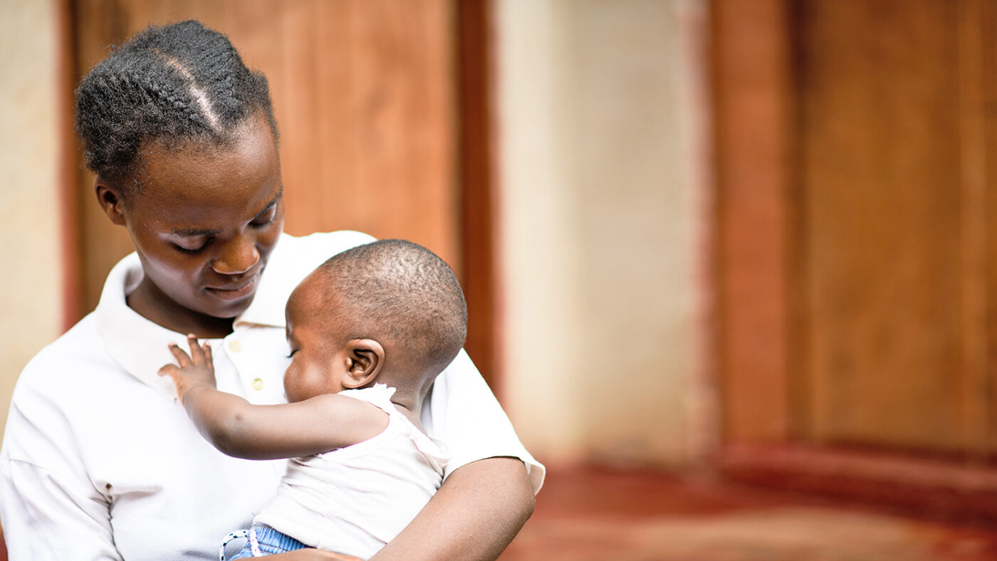 Chimwemwe's mother hugs him tight.