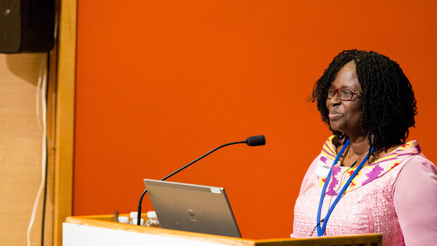 Getty stands at a podium while speaking at an event in Ghana.