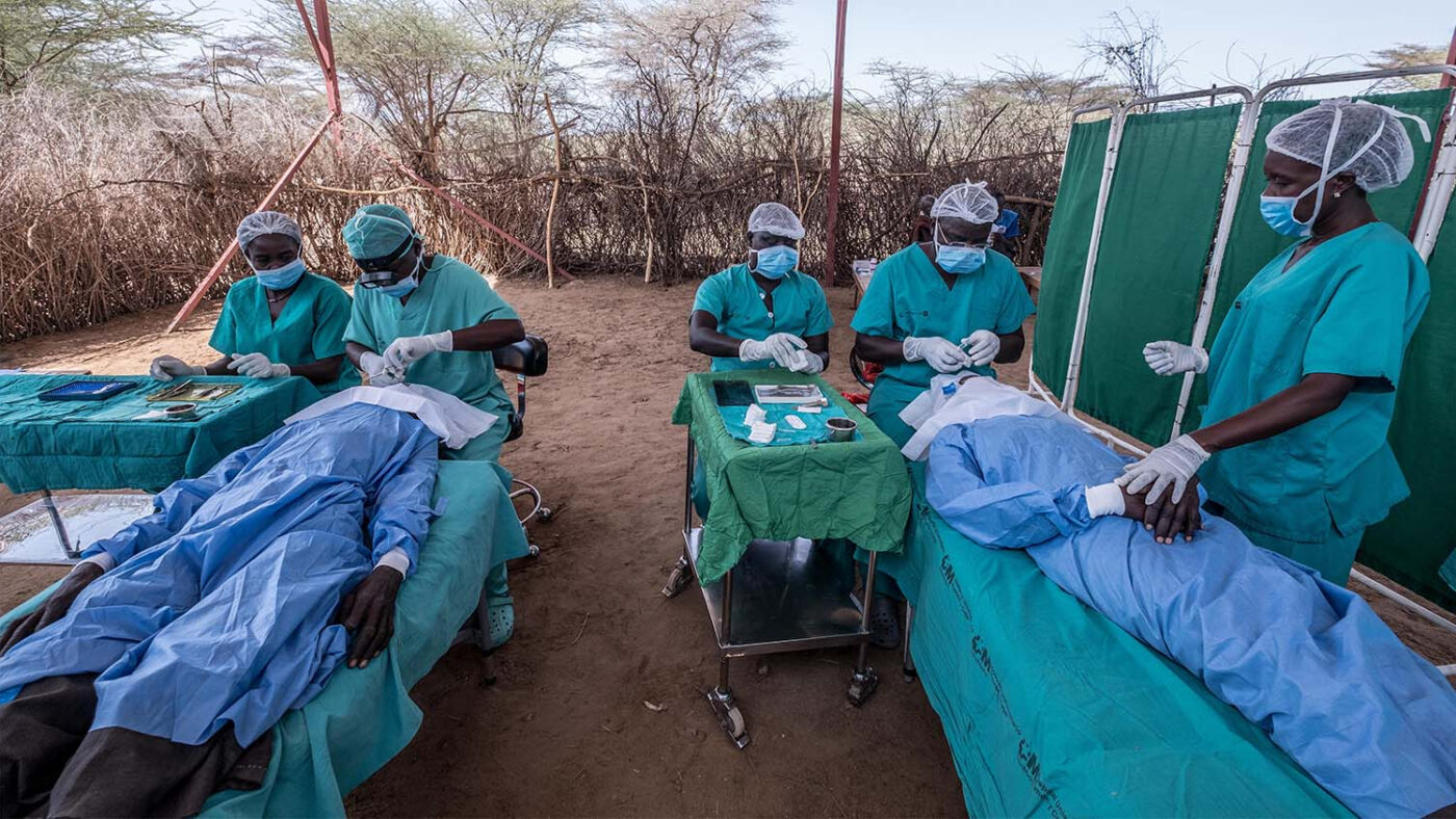 A group of surgeons perform trachoma operations inside a makeshift operating theatre in a remote area of Turkana, Kenya