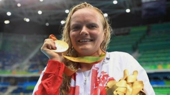 Susie Rodgers holds her gold medal at the 2016 Paralympic Games in Rio.