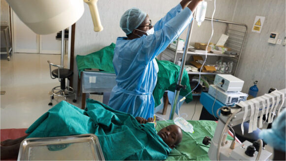 A doctor prepares Joseph for cataract surgery.