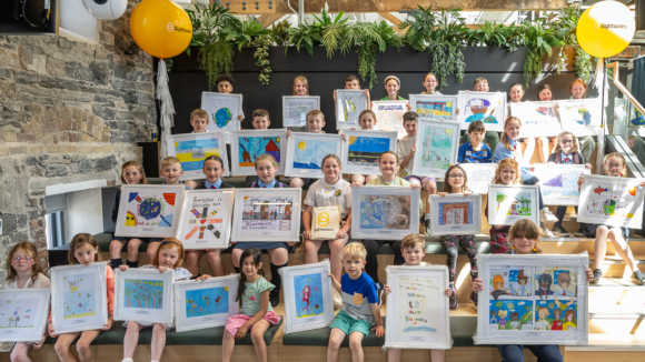 Junior Painter of the Year contestants are all pictured together holding up their artwork.