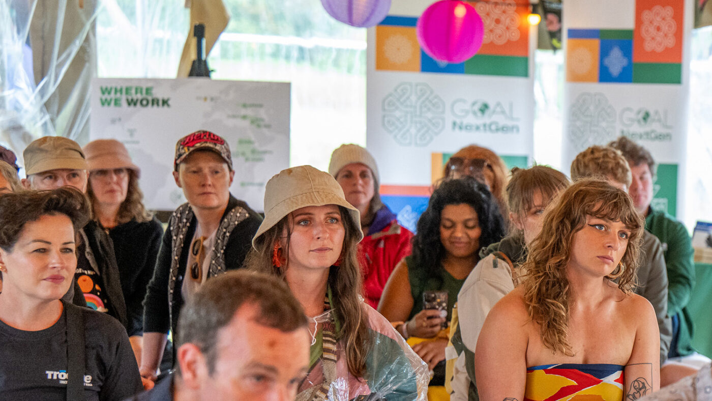 An audience listens to a presentation by Sightsavers Ireland at All Together Now festival.